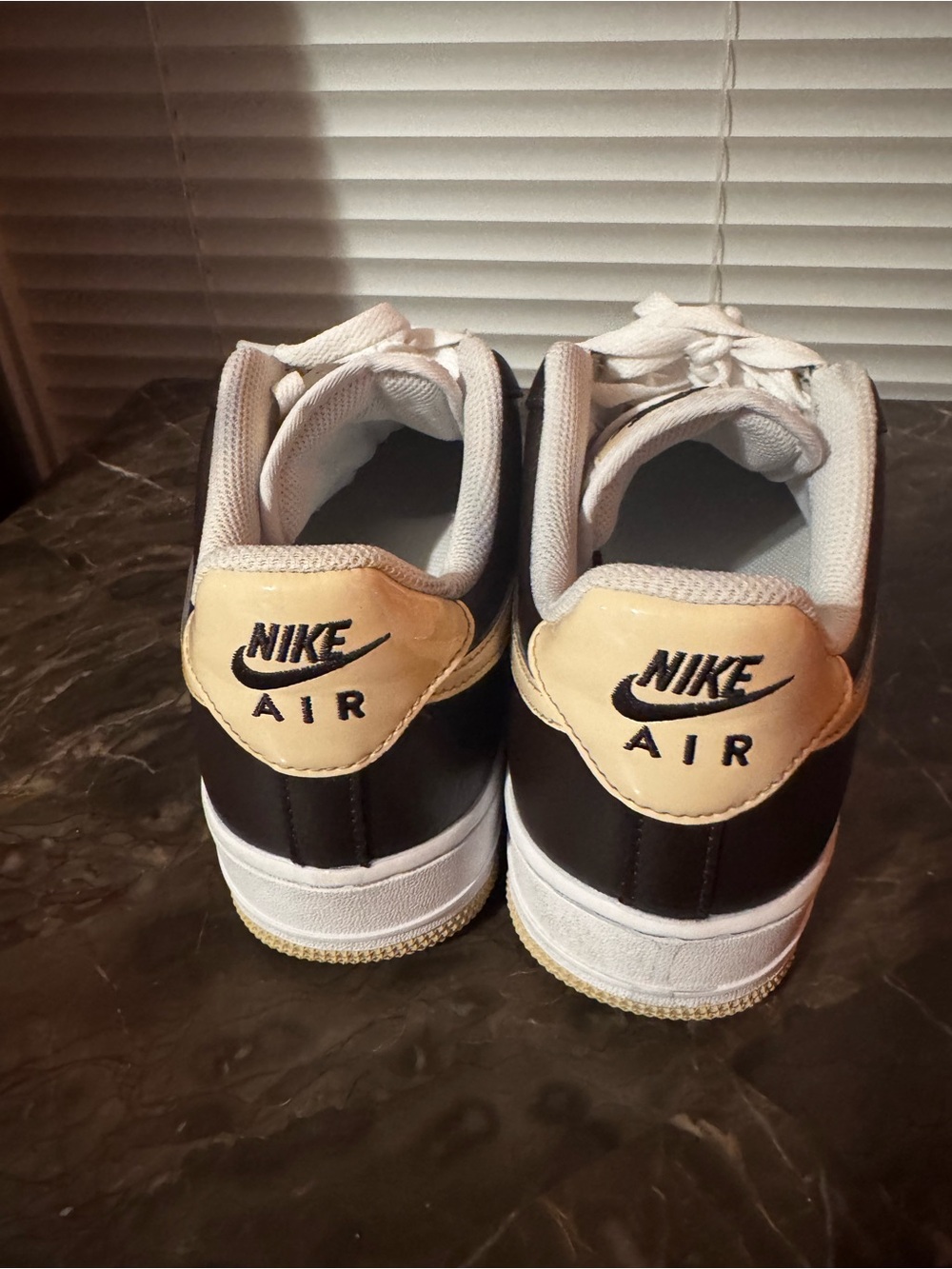 Nike Air Force women’s Low-Top Sneakers in Black and Cream